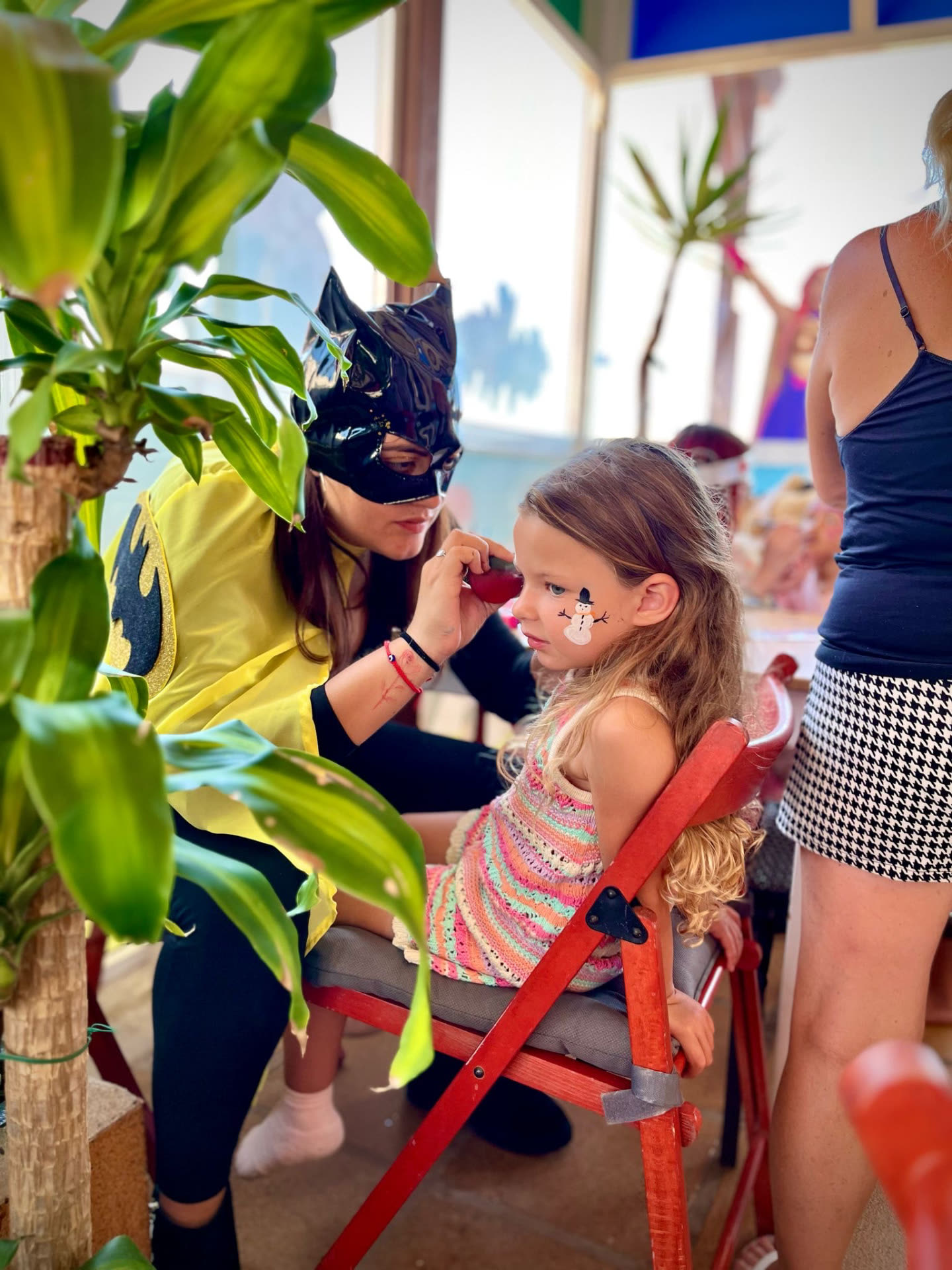 Face painting with a costumed entertainer at Dream Park
